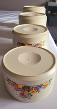 Load image into Gallery viewer, Nesting Canister Set (set of 4) Vintage in good pre-used condition
